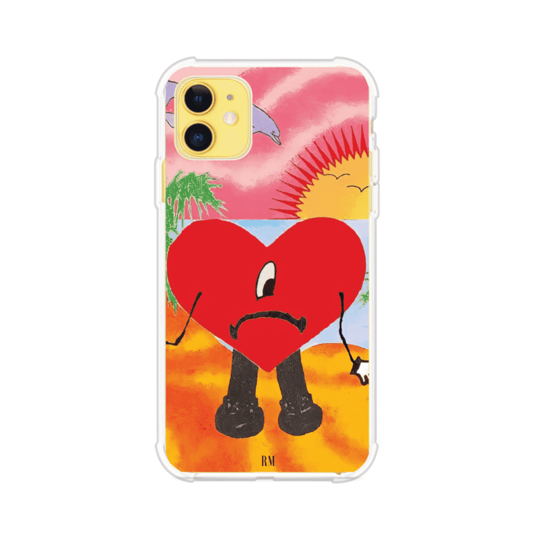Funda para iPhone inspirada en el álbum "Un Verano Sin Ti" de Bad Bunny. Diseño con fondo de playa, palmeras, atardecer, delfines y el icónico corazón triste con piernas. Estilo colorido, urbano y veraniego. Producto de Remark Mx