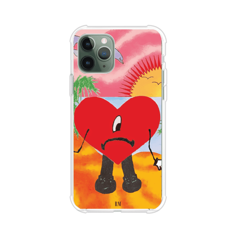 Funda para iPhone inspirada en el álbum "Un Verano Sin Ti" de Bad Bunny. Diseño con fondo de playa, palmeras, atardecer, delfines y el icónico corazón triste con piernas. Estilo colorido, urbano y veraniego. Producto de Remark Mx