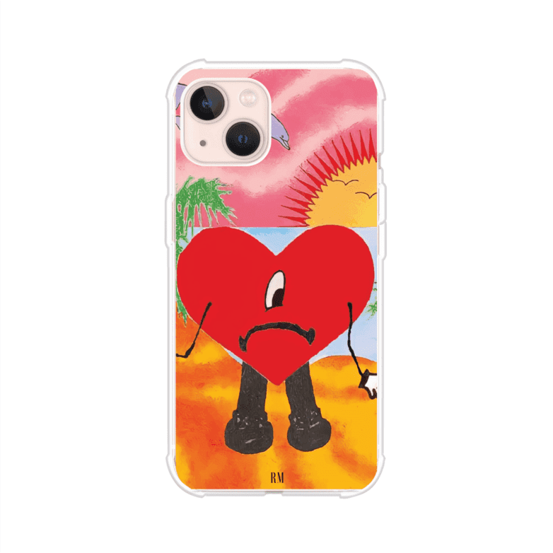 Funda para iPhone inspirada en el álbum "Un Verano Sin Ti" de Bad Bunny. Diseño con fondo de playa, palmeras, atardecer, delfines y el icónico corazón triste con piernas. Estilo colorido, urbano y veraniego. Producto de Remark Mx