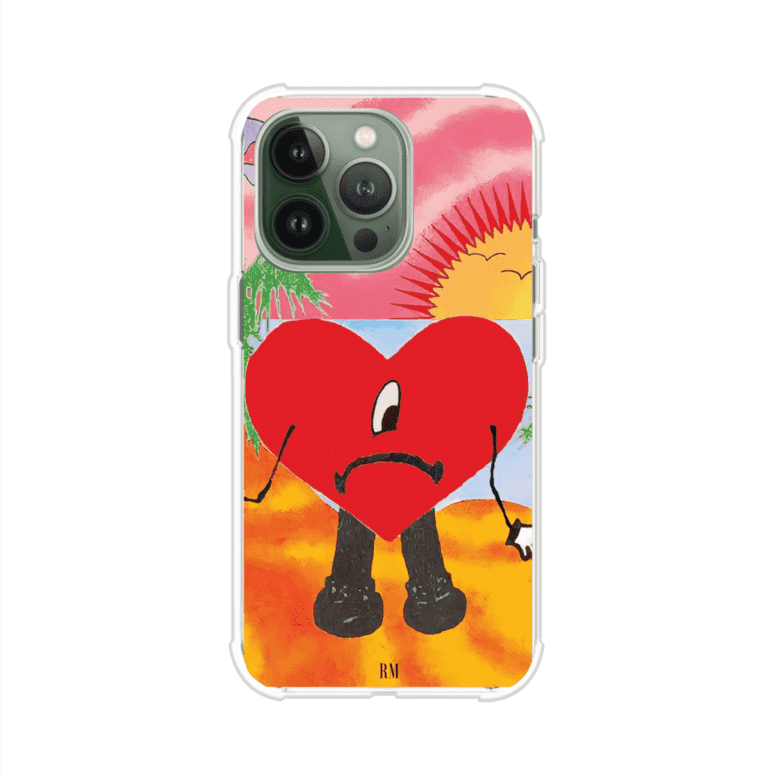 Funda para iPhone inspirada en el álbum "Un Verano Sin Ti" de Bad Bunny. Diseño con fondo de playa, palmeras, atardecer, delfines y el icónico corazón triste con piernas. Estilo colorido, urbano y veraniego. Producto de Remark Mx