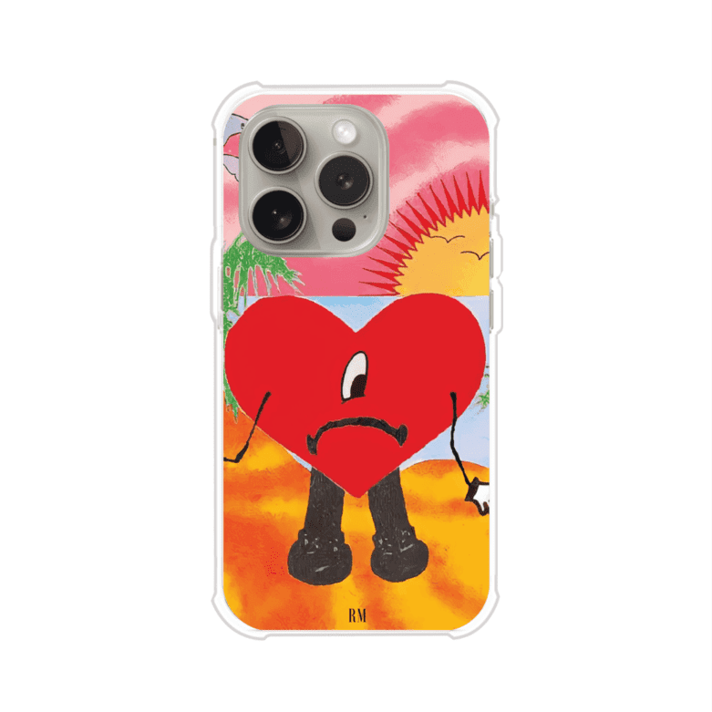 Funda para iPhone inspirada en el álbum "Un Verano Sin Ti" de Bad Bunny. Diseño con fondo de playa, palmeras, atardecer, delfines y el icónico corazón triste con piernas. Estilo colorido, urbano y veraniego. Producto de Remark Mx