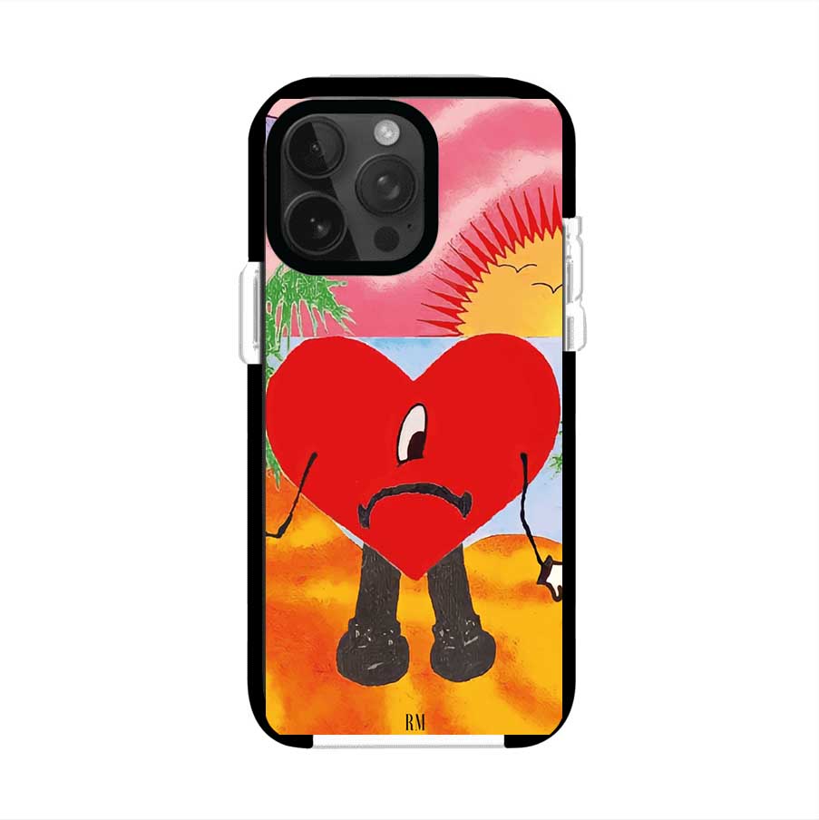 Funda para iPhone inspirada en el álbum "Un Verano Sin Ti" de Bad Bunny. Diseño con fondo de playa, palmeras, atardecer, delfines y el icónico corazón triste con piernas. Estilo colorido, urbano y veraniego. Producto de Remark Mx