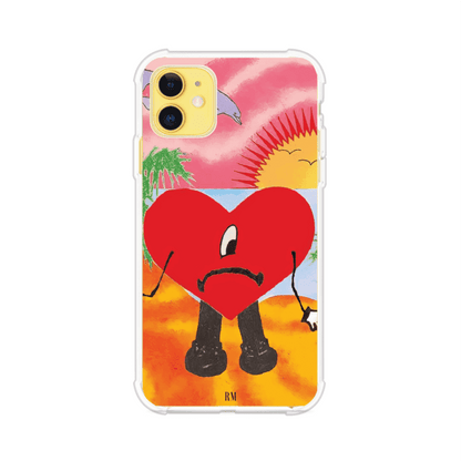 Funda para iPhone inspirada en el álbum "Un Verano Sin Ti" de Bad Bunny. Diseño con fondo de playa, palmeras, atardecer, delfines y el icónico corazón triste con piernas. Estilo colorido, urbano y veraniego. Producto de Remark Mx