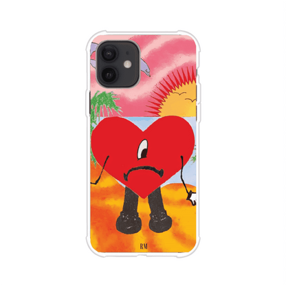 Funda para iPhone inspirada en el álbum "Un Verano Sin Ti" de Bad Bunny. Diseño con fondo de playa, palmeras, atardecer, delfines y el icónico corazón triste con piernas. Estilo colorido, urbano y veraniego. Producto de Remark Mx